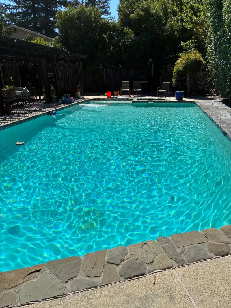 The pool after Oasis Green to Clean service, with clear turquoise water