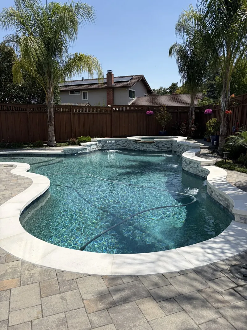 A residential pool and spa from the Oasis Pool Services photo collection